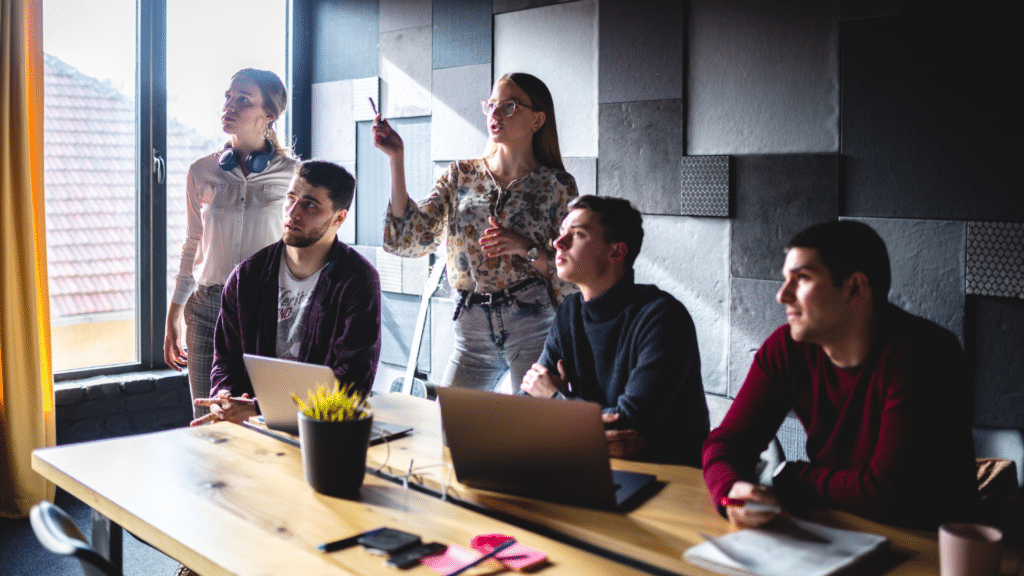 An image of a small business owner in a team meeting with her staff in London Ontario Canada