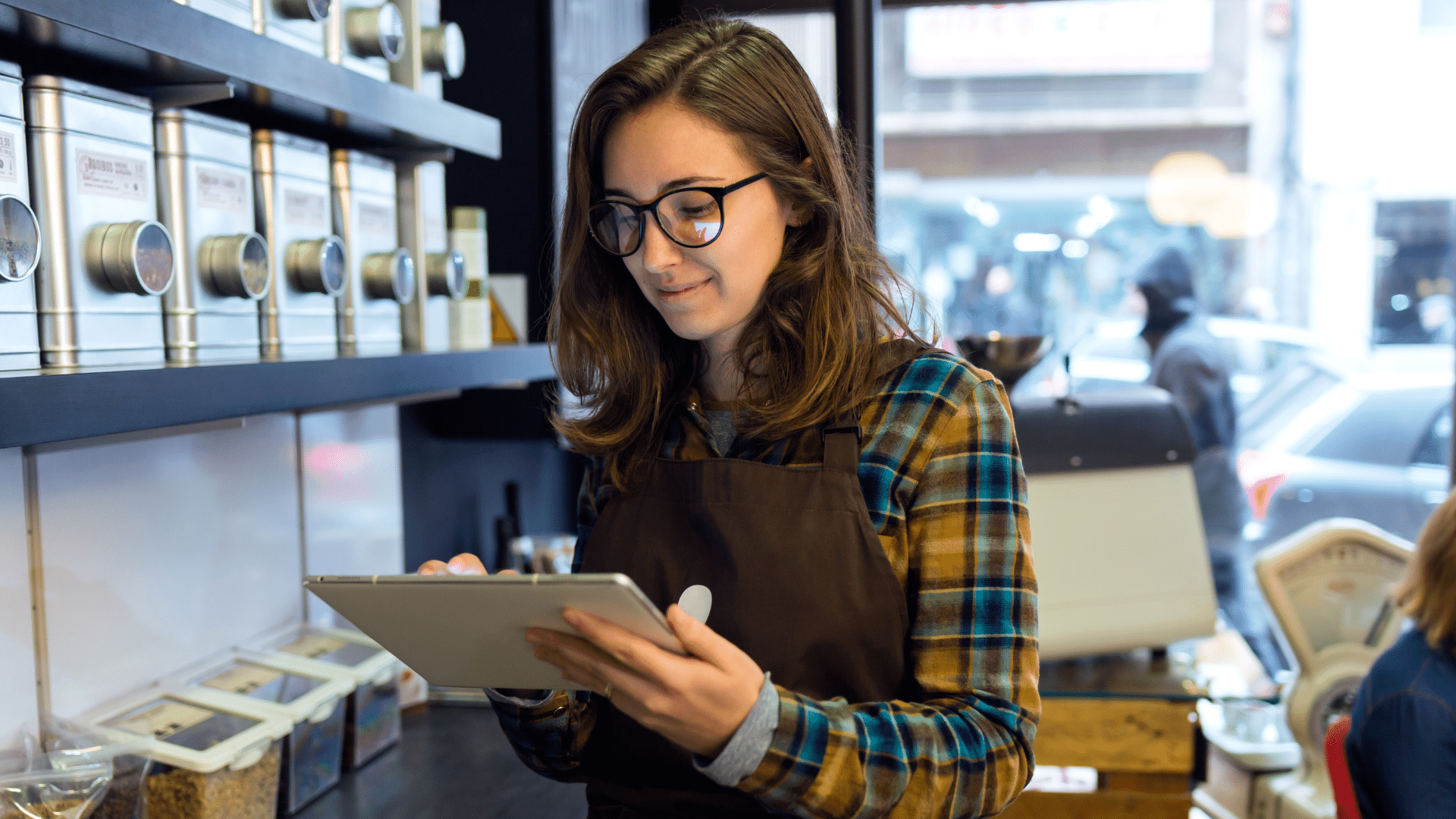 An image of a small business owner in London Ontario, reviewing and inventory accounting report