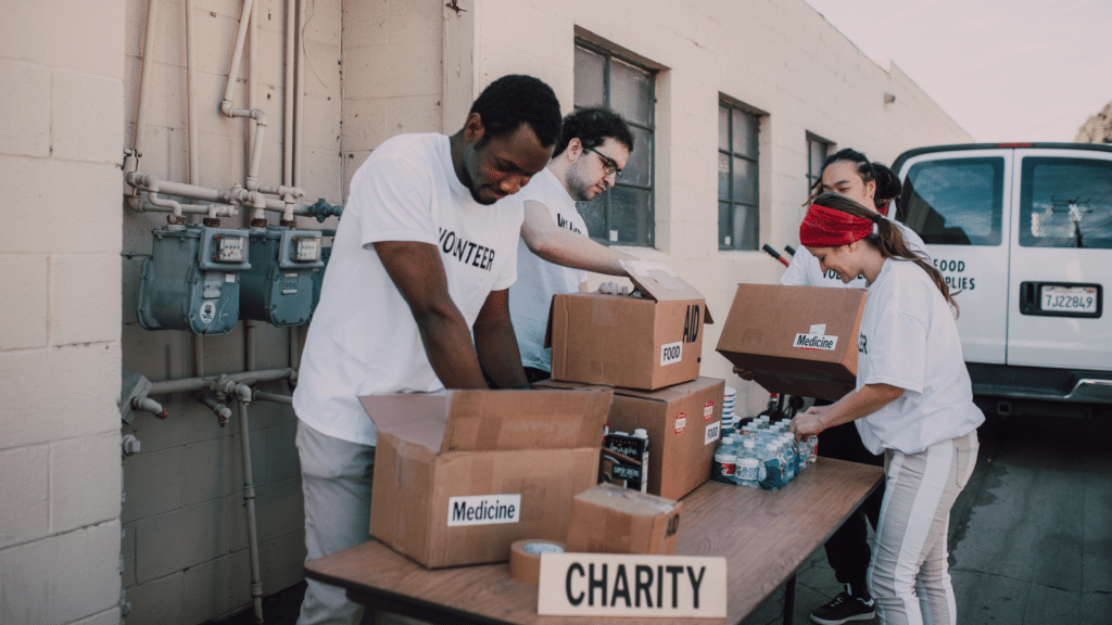 An image of a group of volunteers sorting donations for their local London charity